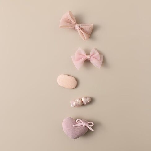 20-piece soft pink baby hair accessory set, featuring bowknots, heart shapes, and star patterns, fully lined anti-slip hair clips, suitable for fine hair, and snap-on hair clips for newborns in Kuwait