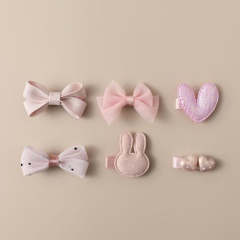 20-piece soft pink baby hair accessory set, featuring bowknots, heart shapes, and star patterns, fully lined anti-slip hair clips, suitable for fine hair, and snap-on hair clips for newborns in Kuwait