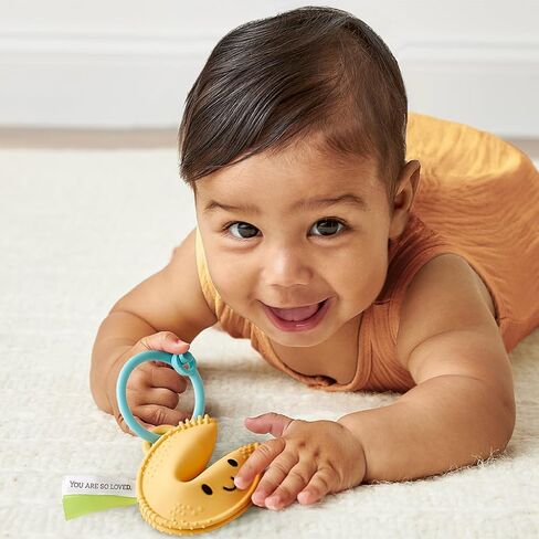 Itzy Ritzy Fortune Cookie Teether - BPA-Free Soft Silicone Baby Teething Toy with Satin Sensory Ribbons and Silicone Ring - for Ages 3 Months and Up (Fortune Cookie) in Kuwait