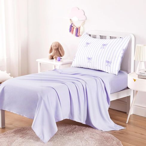 Wake In Cloud - Toddler Bedding Set for Girls, Vertical Stripes with Cute Bows, 4 Pieces Soft Crib Bed Set Including Comforter, Sheets and Pillowcase, Light Purple in Kuwait