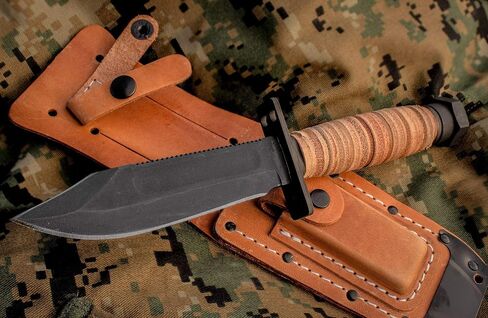 Ontario Knife Company 499 Air Force Survival Knife 5 "شفرة منشار مع حافة علوية زائفة وأخاديد دم، مقبض من الجلد الطبيعي وغمد - 6150 (قد يختلف اللون)، أسود in Kuwait