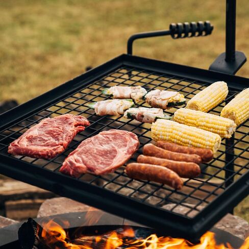 TITAN GREAT OUTDOORS شواية دوارة قابلة للتعديل من Ash & Ember، شبكة طبخ من سلك شبكي فولاذي مع عمود سبايك، معدات تخييم محمولة للشواء مفتوحة النار in Kuwait