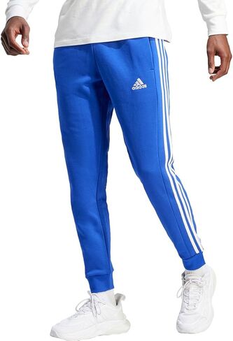 بنطال رجالي من adidas Essentials Fleece 3-Stripes بأساور مدببة، أزرق شبه شفاف in Saudi Arabia
