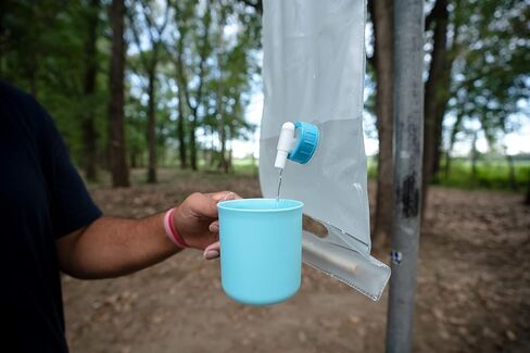 ust 10L Roll-Up Collapsible Water Carrier with Wooden Handles and BPA Free, Transparent Construction for Drinking, Bathing, Camping, Hiking and Outdoor Survival in Kuwait