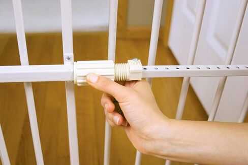 Carlson 24-38" Lil Tuffy Expandable Metal Dog Gate for Doorways, Indoor Pet Gate with Small Pet Door, No-Drill Pressure Mount, White in Kuwait
