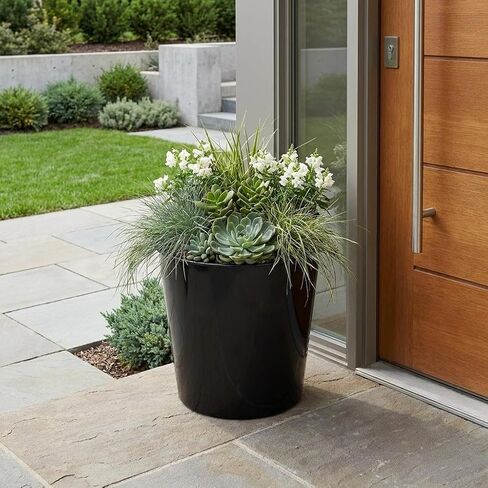 HomeRoots 11" Black Recycled Plastic Indoor Outdoor Round Pot Planter in Saudi Arabia