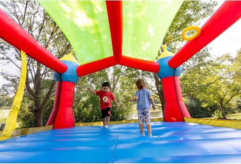 Bounceland Inflatable Party Castle Bounce House Bouncer, 16 ft L x 13 ft W x 10.3 ft H, Basketball Hoop, Removable Sun Roof, UL Strong Blower included, Fun Slide and Bounce Area, Castle Theme for Kids in Saudi Arabia