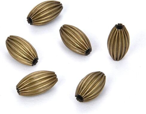 50pcs Beautiful Melon Spacer 7mm x 4mm Corrugated Oval Rice Shape Metal Loose Beads Antique Bronze Plated Brass for Jewelry Craft Making CF129-1 in Kuwait