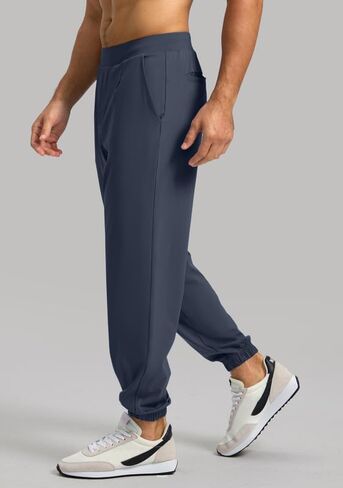 فيوديا سروال رياضي للرجال مع جيب بسحاب، سروال رياضي قابل للتمدد بقصة ضيقة للرجال للجري والتمارين الرياضية in Kuwait