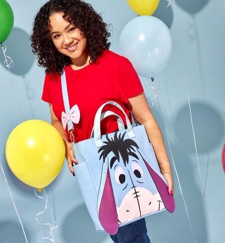 حقيبة يد Loungefly Eeyore Smile قابلة للتحويل ويني ذا بوه in Kuwait