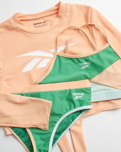 مجموعة Rash Guard للفتيات من ريبوك - 3 قطع قميص سباحة بأكمام طويلة بعامل حماية من الأشعة فوق البنفسجية 50+ مع بدلة سباحة بيكيني - مجموعة ملابس سباحة للفتيات (4-12) in Saudi Arabia