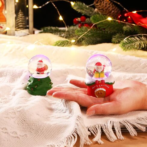 Shappy 2 Pcs Christmas Glitter Water Globe 1.77 inch Mini Snow Globe Santa Claus Christmas Tree Snowman Snow Christmas Elements Snow Globe House Decoration with LED Light for Family Office in Saudi Arabia