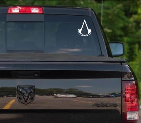 DW - ملصق لاصق من الفينيل مقطوع بشعار لعبة Assassin's Creed للسيارات والشاحنات وأجهزة الكمبيوتر المحمولة والنوافذ| أبيض | 6.5" in Kuwait