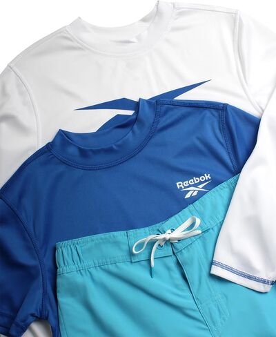 مجموعة Rashguard للأولاد من ريبوك - 3 قطع قمصان سباحة بأكمام طويلة وأكمام قصيرة بعامل حماية من الأشعة فوق البنفسجية 50+ وشورت سباحة (S-XL) in Saudi Arabia