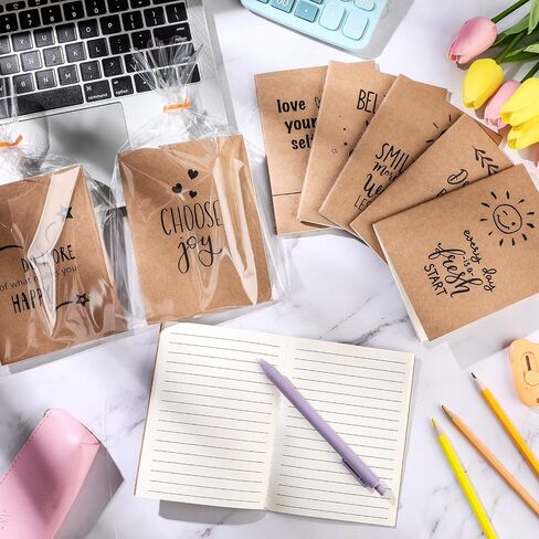 Outus 24 Set Kraft Pocket Notebook with Clear Plastic Bags 12 Designs A6 Mini Composition Notebook Lined Journals Graduation Gifts for Students Kids Women Stuff 4 x 5.5 Inches, 64 Pages in Saudi Arabia