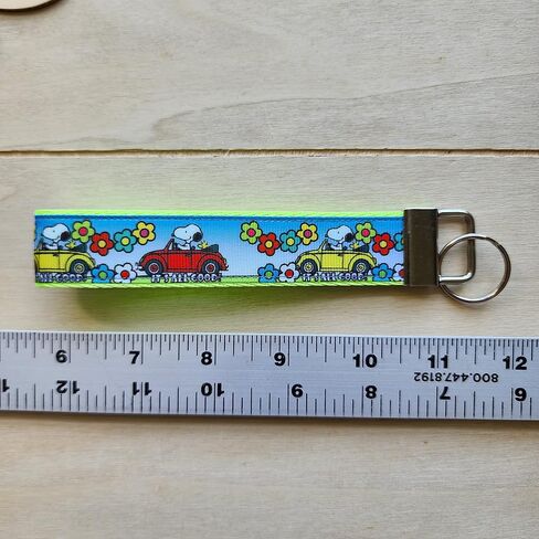 Traveling cartoon beagle dog with bug car wristlet, Julie Ng Studio handmade, boy scout camping sunflower traveling key fob, chibi beagle cartoon anime beagle dog keychain in Saudi Arabia