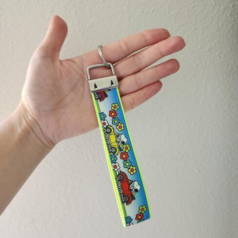 Traveling cartoon beagle dog with bug car wristlet, Julie Ng Studio handmade, boy scout camping sunflower traveling key fob, chibi beagle cartoon anime beagle dog keychain in Saudi Arabia