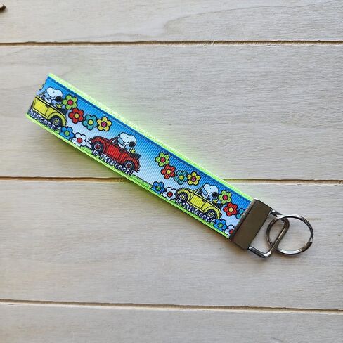 Traveling cartoon beagle dog with bug car wristlet, Julie Ng Studio handmade, boy scout camping sunflower traveling key fob, chibi beagle cartoon anime beagle dog keychain in Saudi Arabia