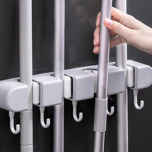 حامل مكنسة وممسحة مثبت على الحائط، 5 خطافات و4 فتحات، منظم رف أدوات الحديقة اللاصق لغرفة غسيل المرآب في الخزانة، شماعة مضادة للانزلاق للمكانس والمماسح والمكابس ومجارف الغبار، 13 × 2.2 × 1.8 بوصة in Kuwait