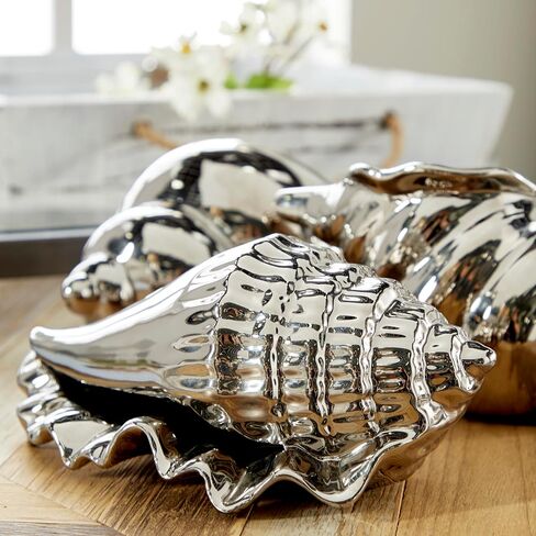 Deco 79 Ceramic Shell Decorative Sculpture Shell Home Decor Statues, Set of 3 Accent Figurines 7", 7", 5"W, Silver in Saudi Arabia