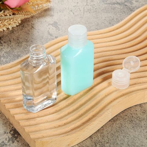 APACALI 100PCS Plastic Travel Bottles 1oz Mini Shampoo Bottles Small Empty Bottles Refillable Cosmetic Containers with Flip Cap Clear Portable Small Bottles for Liquid, Lotions, Toner, Body Soap in Saudi Arabia