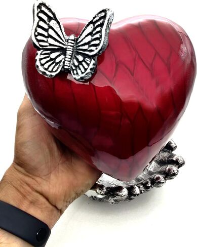 Butterfly Heart Urn for Ashes - Hand Painted with Red Color - Unique Memorial Keepsake for Loved Ones - Decorative Cremation Urn for Home or Office Comes with Unique Hand Shape Stand. in Saudi Arabia
