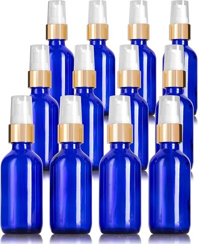 JUVITUS 2 oz / 60 ml Cobalt Blue Glass Boston Round Bottle with Gold Treatment Pump (12 Pack) in Saudi Arabia