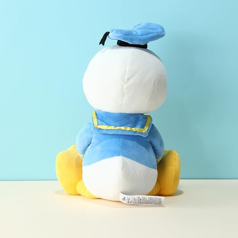 MINISO Disney Holding-Heart Plush Toy (Donald), Cuddly Stuffed Animal with Heart Emblem Soft and Huggable Collectible Toy for Disney Fans, Ideal for Bedtime Cuddles and Room Decor in Saudi Arabia