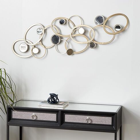 Deco 79 Metal Geometric Home Wall Decor Wall Sculpture with Round Mirrored Accents, Wall Art 52" x 2" x 16", Gold in Saudi Arabia