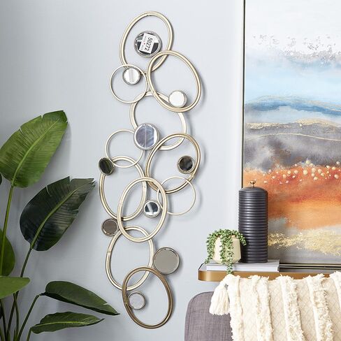 Deco 79 Metal Geometric Home Wall Decor Wall Sculpture with Round Mirrored Accents, Wall Art 52" x 2" x 16", Gold in Saudi Arabia