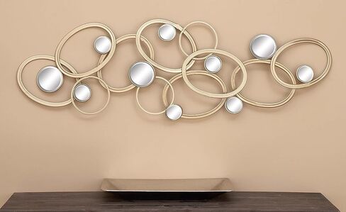 Deco 79 Metal Geometric Home Wall Decor Wall Sculpture with Round Mirrored Accents, Wall Art 52" x 2" x 16", Gold in Saudi Arabia