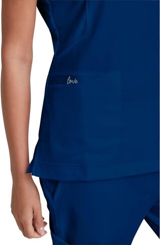 BARCO Grey's Anatomy Scrubs - Kira Scrub Top للنساء، رقبة على شكل حرف V، جيب بسحاب مطبوع عليه Love، قميص فرك نسائي فائق النعومة in Kuwait