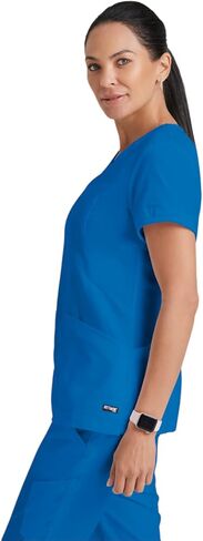 BARCO Grey's Anatomy Scrubs - Kira Scrub Top للنساء، رقبة على شكل حرف V، جيب بسحاب مطبوع عليه Love، قميص فرك نسائي فائق النعومة in Saudi Arabia