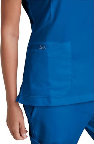 BARCO Grey's Anatomy Scrubs - Kira Scrub Top للنساء، رقبة على شكل حرف V، جيب بسحاب مطبوع عليه Love، قميص فرك نسائي فائق النعومة in Saudi Arabia