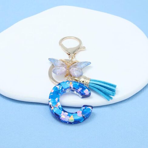 Mlouye A-Z سلاسل مفاتيح الحروف الأبجدية الأولية من الراتنج على شكل قلب الحب مع فراشة وشرابة لمفاتيح السيارة in Kuwait