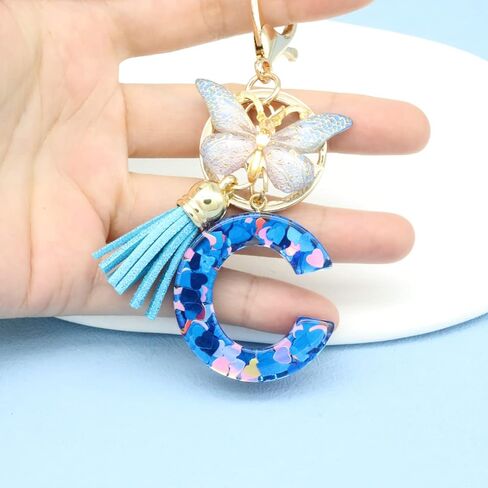 Mlouye A-Z سلاسل مفاتيح الحروف الأبجدية الأولية من الراتنج على شكل قلب الحب مع فراشة وشرابة لمفاتيح السيارة in Kuwait