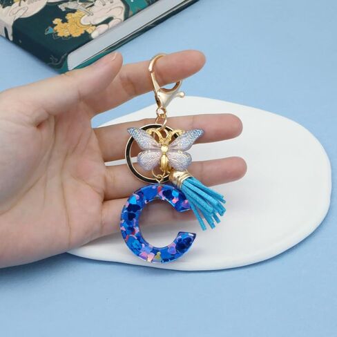 Mlouye A-Z سلاسل مفاتيح الحروف الأبجدية الأولية من الراتنج على شكل قلب الحب مع فراشة وشرابة لمفاتيح السيارة in Kuwait