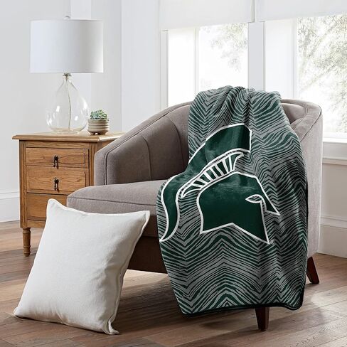 Zubaz من Northwest NCAA Zubified Raschel Throw Blanket 50 X 60، ولاية ميشيغان سبارتانز in Kuwait