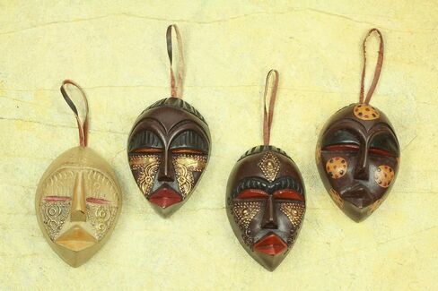 NOVICA Decorative Christmas Wood Hanging Holiday Ornaments, Assorted 'Celebration Masks' (Set of 4) in Saudi Arabia
