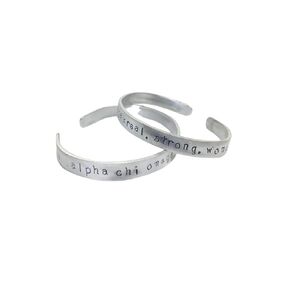Alpha Chi Omega, Real. Strong. Women. AXO Greek Sorority Quote Bracelet made of non tarnish aluminum