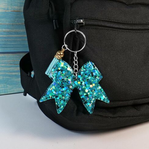 سلسلة مفاتيح لامعة على شكل فيونكة - سلاسل مفاتيح ساحرة للفتيات ملحقات حقيبة الظهر التشجيعية، هدية مبهجة لقادة المشجعين وأعضاء الفريق - أزرق فاتح/قطعتين in Kuwait