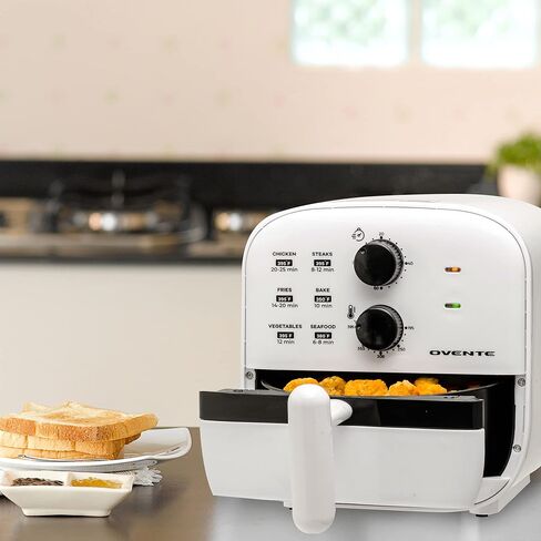 مقلاة هوائية صغيرة من OVENTE، قوة 700 واط بسعة 1 لتر، أضواء مؤشر، درجة حرارة ومؤقت قابلان للتعديل، مثالية للاستخدام الشخصي لطهي القلي الصحي والخالي من الزيت، والخبز والطعام المشوي، أبيض FAM21101W in Kuwait