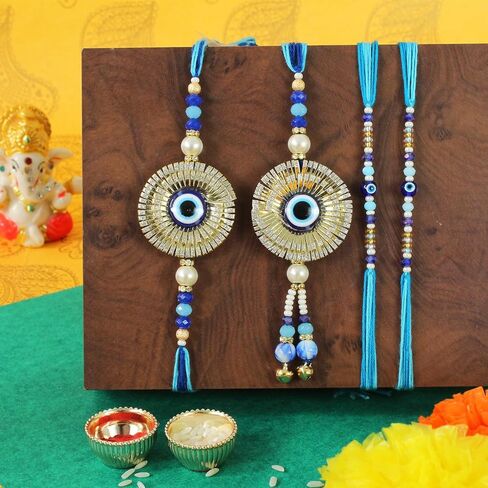 TIED RIBBONS Rakhi for Brother and Bhabhi and Bhatija | Rakhi for Bhatija (Set of 2) | Buddha Monk Statue Set of 4 | Mini Card | Roli Tikka - Bhai Bhabhi Rakhi Set | Lumba Rakhi for Bhabhi in Saudi Arabia