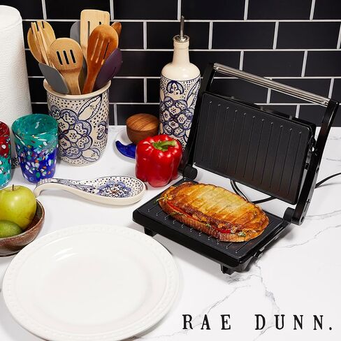 صانع Rae Dunn Panini - شواية ضغط 750 وات مكونة من شريحتين مع أضواء مؤشر | يفتح 180 درجة | تدفئة على الوجهين | طهي غير لاصق | مقبض رائع الملمس | سهل التنظيف، كريمي in Saudi Arabia