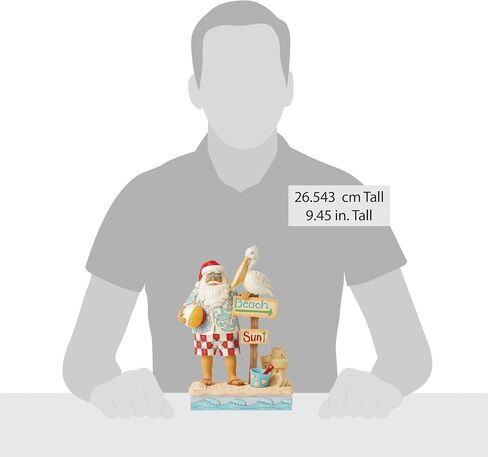 Enesco Jim Shore Heartwood Creek Coastal Santa with Beach Signs and Pelican Figurine- Stone Resin Hand Painted Crafted Collectible Santa Figurines Christmas Home Decor Statue, 9.45 Inch in Saudi Arabia