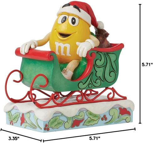 Enesco M&M's by Jim Shore M&M شخصية صفراء تركب في مزلقة - تمثال حلوى M&M مطلي يدويًا من الراتنج الحجري لديكور المنزل في عيد الميلاد، 5.71 بوصة in Saudi Arabia