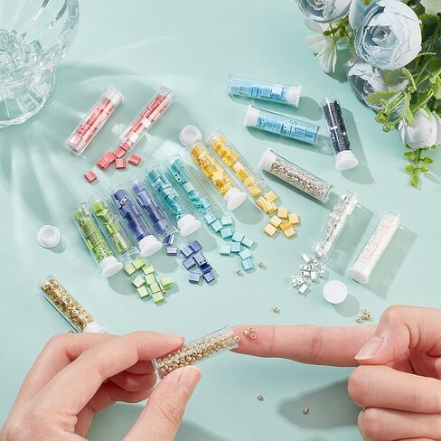 مجموعة خرز تيلا 790 قطعة 3 مقاسات من NBEADS، فاصل خرز زجاجي بفتحتين 10 ألوان مع 300 قطعة خرز بذور مستديرة 5 × 5 مم/5 × 2 مم/5 × 1 مم خرز زجاجي ياباني صغير لسوار وقلادة وأقراط صناعة المجوهرات in Saudi Arabia