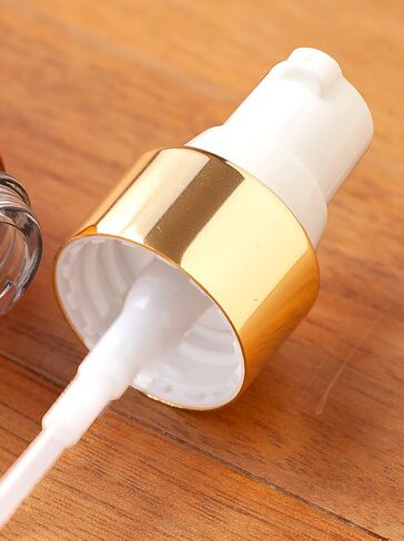 JUVITUS 1 oz / 30 ml Black Glass Luxury Boston Round Bottle with Gold Treatment Pump (12 pack) in Kuwait