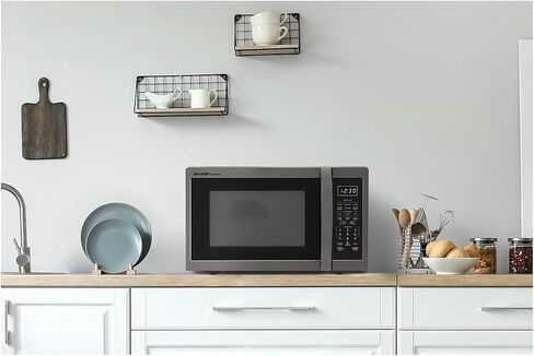 SHARP ZSMC1464HS Oven with Removable 12.4" Carousel Turntable. Orville Redenbacher's Certified Cubic Feet, 1100 Watt with Inverter Technology Countertop Microwave, 1.4 CuFt, Stainless Steel in Saudi Arabia