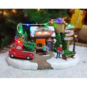 MOMENTS IN TIME Christmas Village Building, 6.7"H Polyresin Christmas Tree Lot with LED Lightup & Music - Battery Operated (not Included)